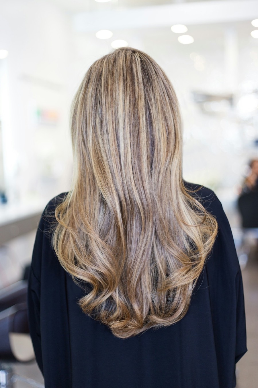 Long blonde hair with soft dimensional waves