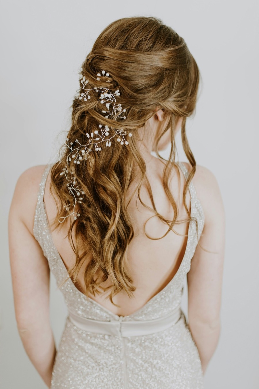 Soft bridal waves with a delicate hair vine
